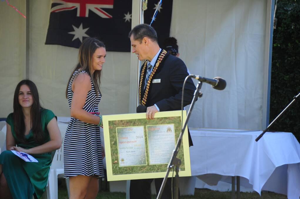 Payton Smede receives her Junior Sportsperson of the Year Award from Dubbo mayor Mathew Dickerson. 					    Photo: CHERYL BURKE