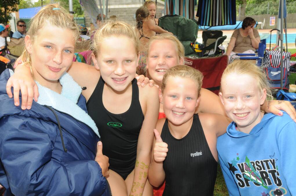 All smiles from Neve Tratt, Jessica Curtin, Grace Osborne, Libby Dixon and Monique May at the Dubbo City Swimtech Carnival. Photo: KATHRYN O'SULLIVAN