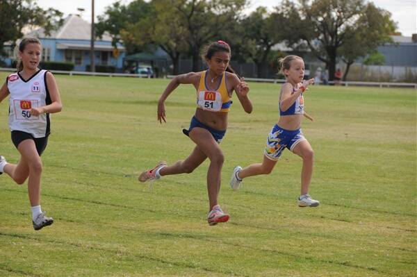 Talented young Dubbo RSL athlete Tullulah Ambrose-Kassis in full stride to win the under-11 100 metres final on Sunday at the New Year carnival.