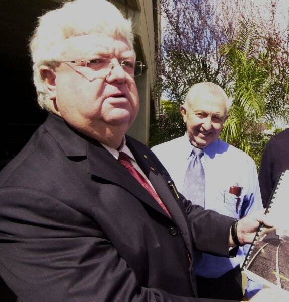 Tony McGrane and Robert Wilson standing out the front of the Daily Liberal building in September 2003.