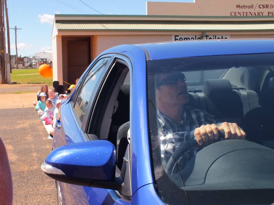 Former Balmain and Australian rugby league great, Wayne "Junior" Pearce takes part in the vehicle backing display.