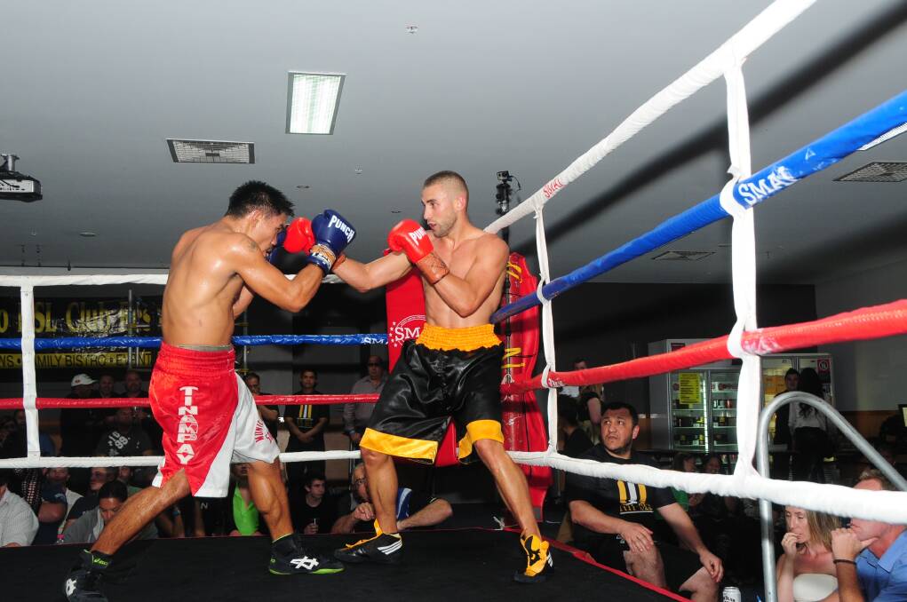 Sam Ah-See going toe-to-toe with Arnel Tinampay in their light middleweight bout on Friday night. 	Photo: HOLLY GRIFFITHS