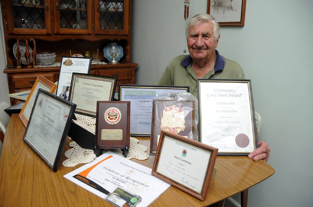 Dubbo resident Ted Mortimer with his many awards given to him over the years 
 	         Photo: BELINDA SOOLE