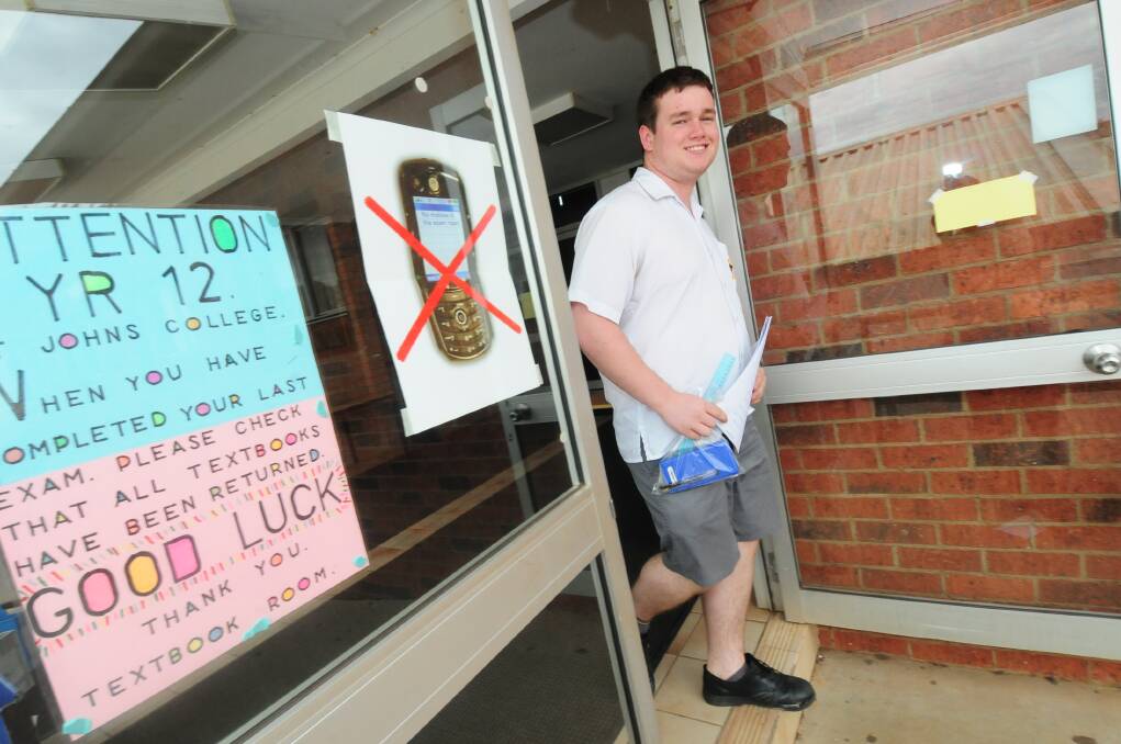 St Johns College year 12 student Brett Latham steps from the exam hall after sitting his mathematics exam. 
Photo: LOUISE DONGES