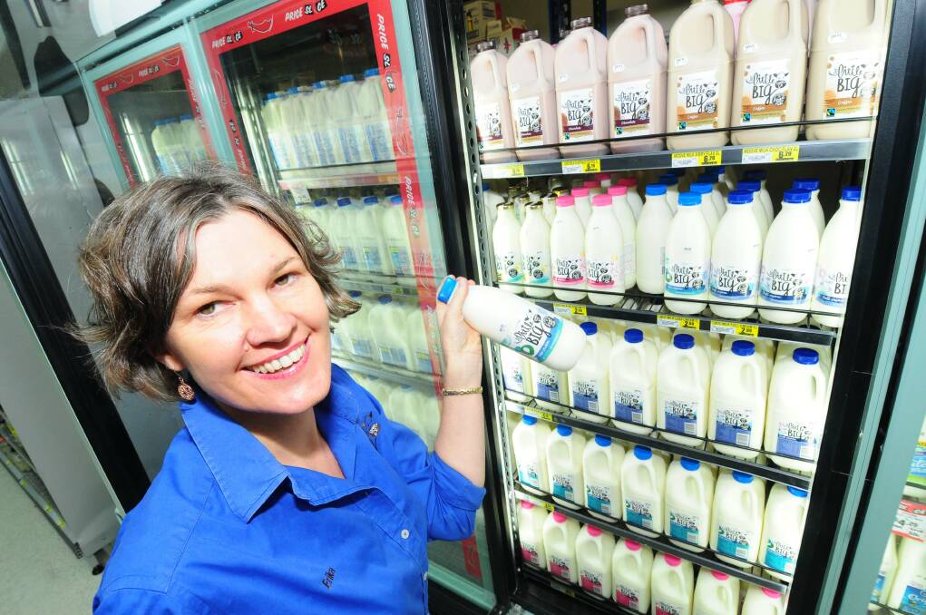 Erika Chesworth from The Little Big Dairy Co. tastes her product with Bernadis IGA dairy/freezer manager Roland Black.						  Photo: LOUISE DONGES
