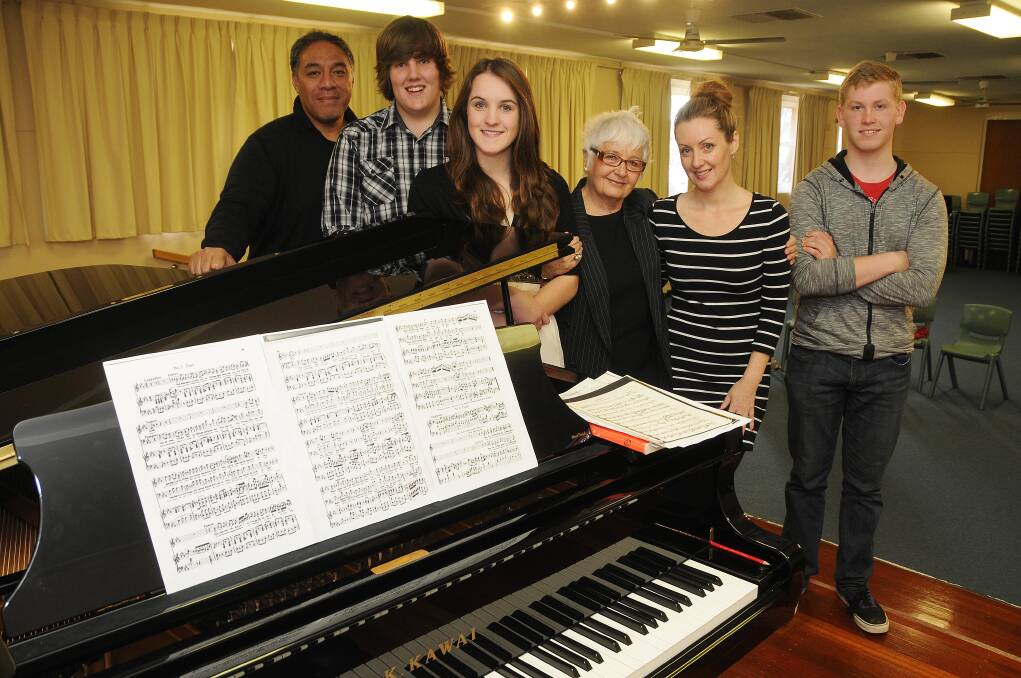 Eddie Muliaumasealii, Nathan Byron, Billie Palin, Dawn Walsh, Annaelle Chaffey and Kylie Harris at the Macqaurie Conservatorium yesterday where students Billie Palin and Nathan Byron recieved tuition and feedback from Oz Opera performers. 	Photo: AMY MCINTYRE