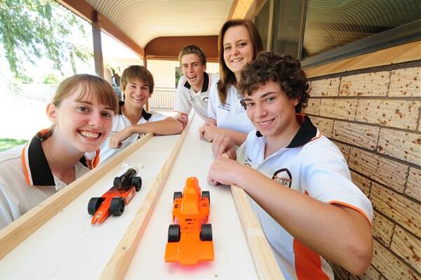 Brianna Turrell, Micah Walker, Aaron Rootes, Sarah McLean and Ben Turner from Dubbo Christian School have there hopes pinned on racing their Formula One model down a 20 metre track in less than a second at the national competition in Sydney.        Photo: AMY GRIFFITHS