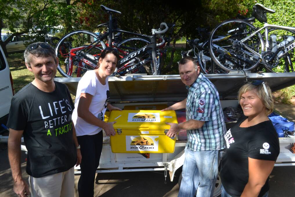 Loading up the trailer yesterday morning at Dubbo were Coonabarabran Cycling Club members Chris Roche, Pip Kearney, Max Estens and Charnelle Crossingham. 	        Photo: SIMON CHAMBERLAIN