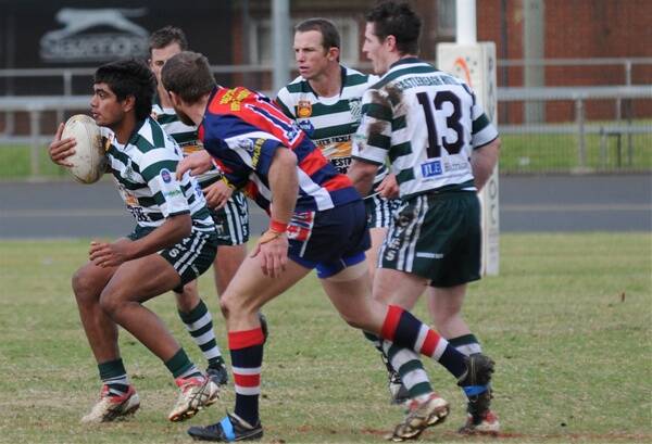 Dubbo College Senior Campus forward Thomas Alchin takes the ball up for CYMS first grade against Cobar.