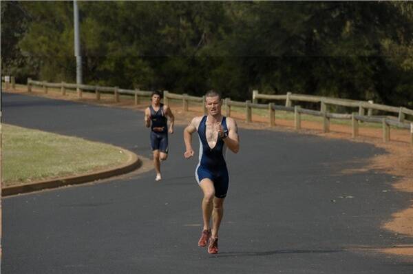 Dubbo Triathlon Club president Craig May powers home to edge out Matt Pellow by six seconds for the first win of the 2007-08 season at Ollie Robbins Oval yesterday.