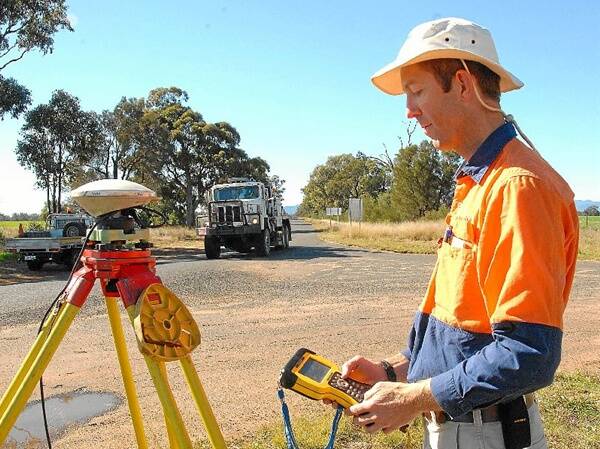 An employee of mining giant Santos trying to locate coal seam gas in the Tooraweenah district.