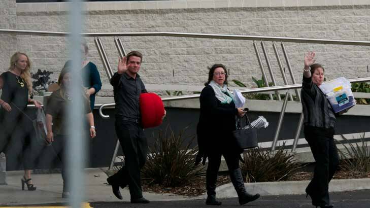 Sacked Target staff leave the company's Geelong headquarters. Photo: Jason South