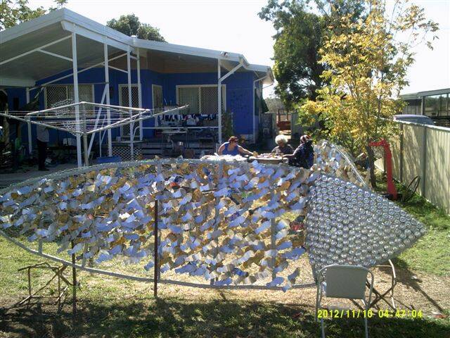 A fish sculpture made entirely from recycled cans and other scrap metal.
