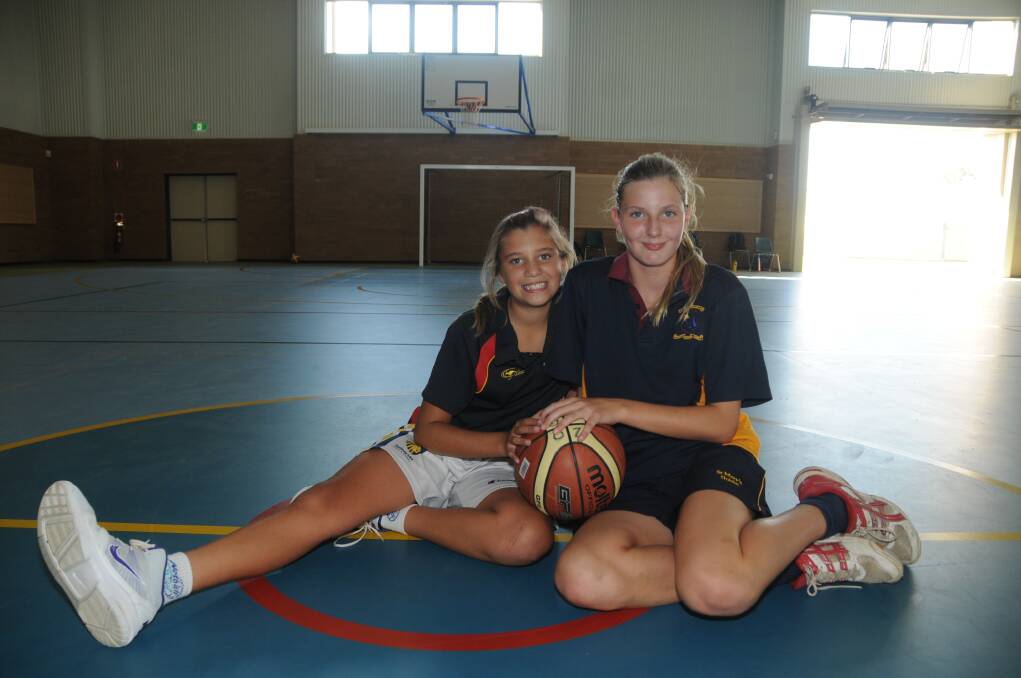 Rebekah Dallinger and Neve Tratt will represent at the NSW PSSA basketball championships in May.  
Photo: AMY McINTYRE