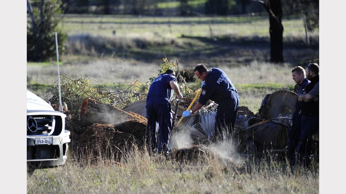 Forensic police during their search of a property on the Sappa Bulga Road on Friday.	Photo: BELINDA SOOLE