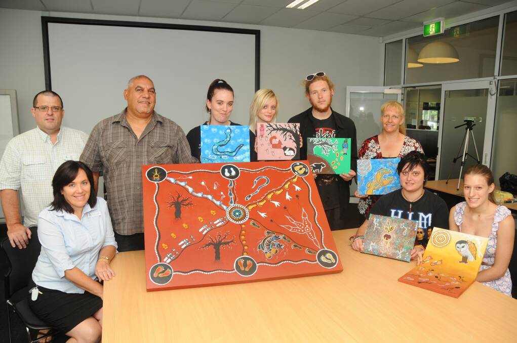 Dubbo Neighbourhood Centre manager Debbie Todkill, Chris Simpson, artist Tom Sloane, students Wendy Parsons, Sidney Barber, Daniel Herbert, Dubbo College Senior Campus learning centre coordinator Michelle Morrissey with Zoey Bowden and Laura Morrissey.               
PHOTO: AMY MCINTYRE