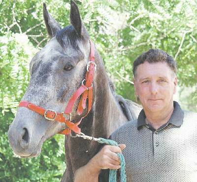 Cowra trainer Rob Cantrell with his XXXX Gold Dubbo Cup contender Rockley Unicorn, to be ridden by female jockey Brooke Timmis. In late Cup developments, Precise Timing has been scratched. Story page 42.