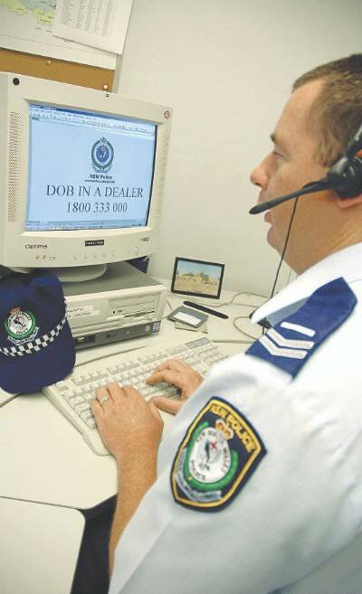 Orana crime prevention officer Senior Constable Anthony Chapman prepares to take calls in the Dob in a Dealer program launched today(MAIN).