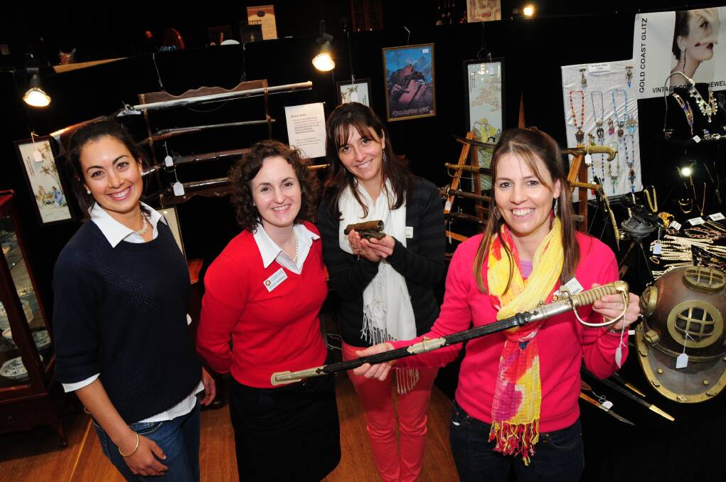 Rotaract club members Kelly Rigg, Stacey Marshall, Sally Pittman and Carla Pittman find items of interest at the Dubbo Antiques and Collectables Fair, proceeds from which will go to charities.	Photo: JOSH HEARD