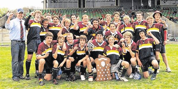 The St John’s College team with coaches Justin mcCarney (left) and Andy Haycock after winning the Vincent Fester Shield for year 7-8 students at Bathurst yesterday.