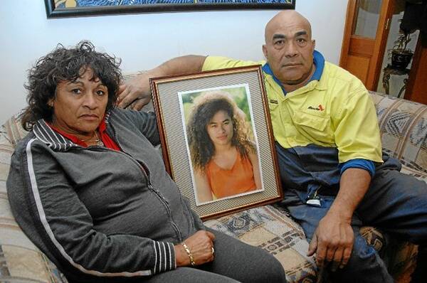 WAITING: MaryAnn and John Hausia with a picture of 17-year-old Amelia. They have been waiting to find out what has happened to their daughter for 19 years.
