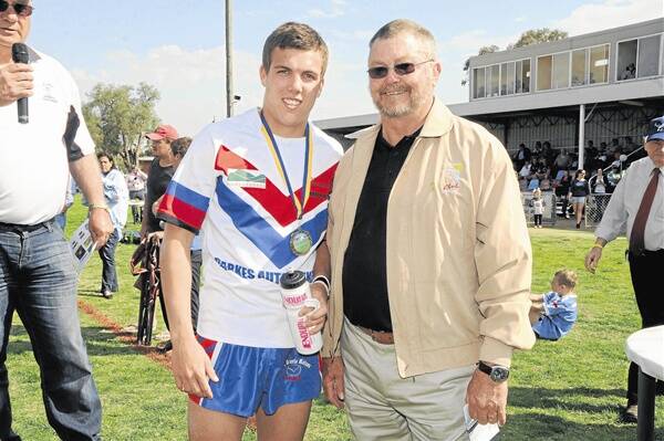 Dubbo RSL Group 11 under-18s grand final hero and man of the match, Toby Evans, with Tom Gray from the RSL club.