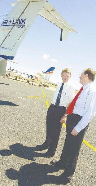 Air Link’s Dave Miller, with former Rex managing director Geoff Bruest, pictured in 2005 when Rex announced it was buying Air Link.