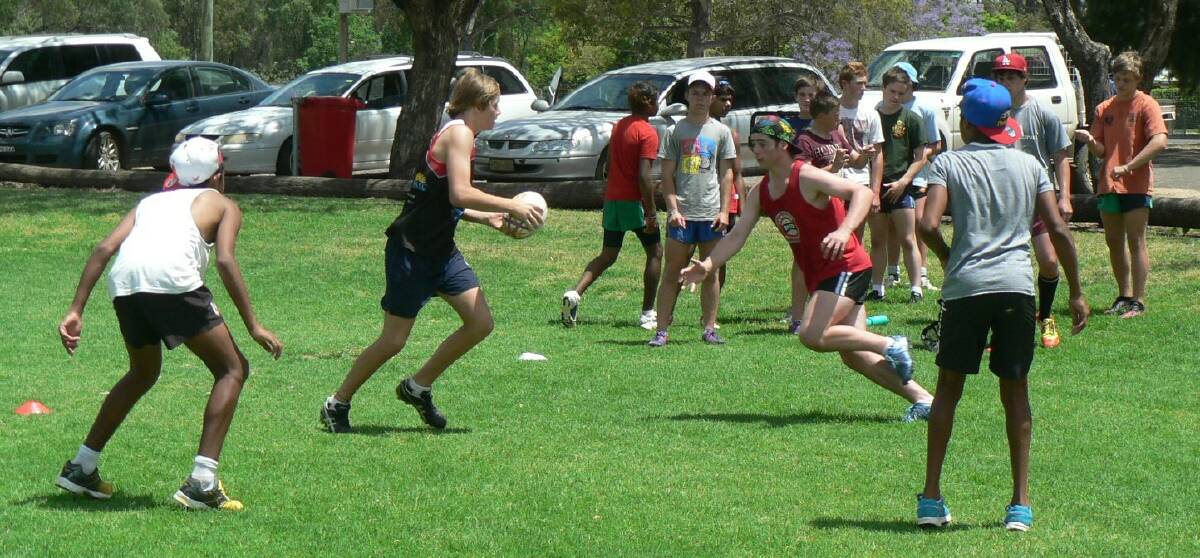 James Goonrey with the ball at the Country Rugby League Far West Academy program. 			   Photo: contributed