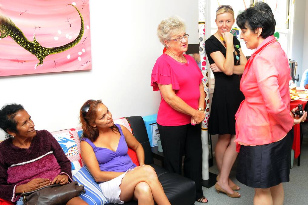 Apollo residents Robyn Ebsworth, Theresa Dodd, Apollo House sewing teacher Margaret Roberts and Commonwealth Rehabilitation Services worker Heidi Russell speak with Community Services Minister Pru Goward at Apollo House. 	Photo: BELINDA SOOLE