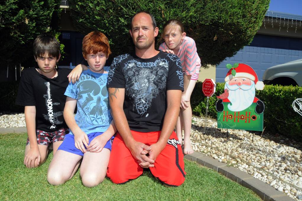 Ethan, Jacob, Brendon and Sarah Howarth were disappointed by the damage left by thieves who targeted their Christmas lights. 	Photo: BELINDA SOOLE