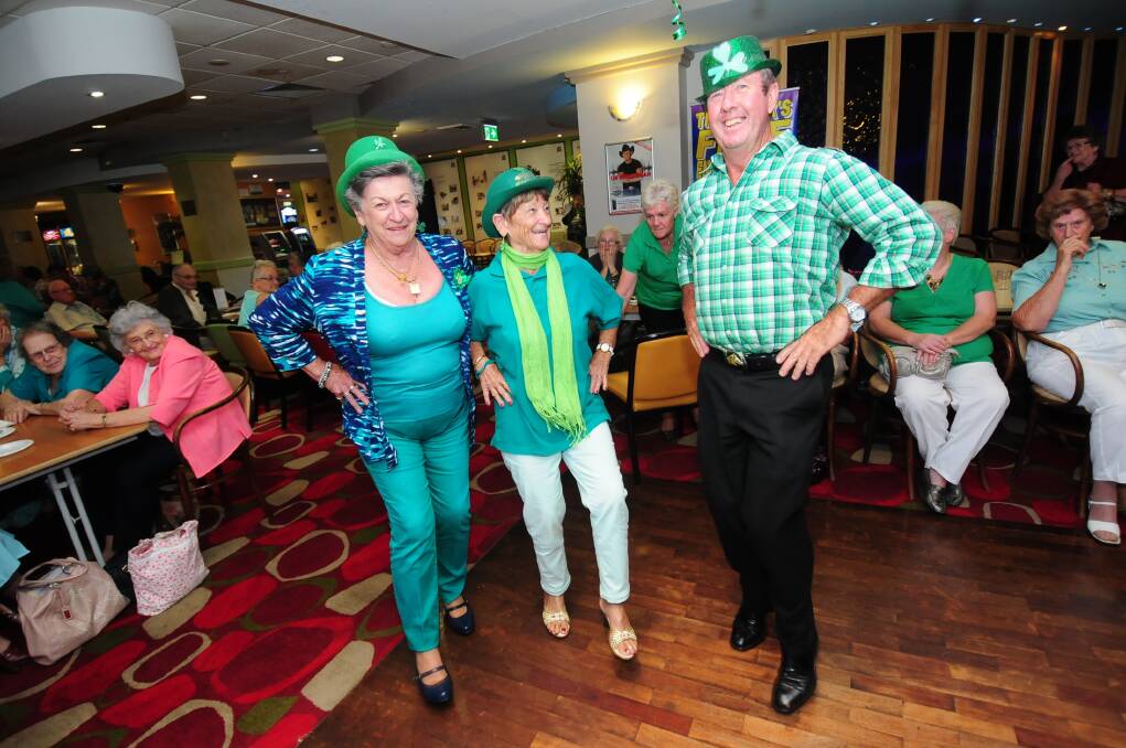 Pat Page, Elizabeth Whittacker and Peter Gallen enjoy doing a little Irish jig