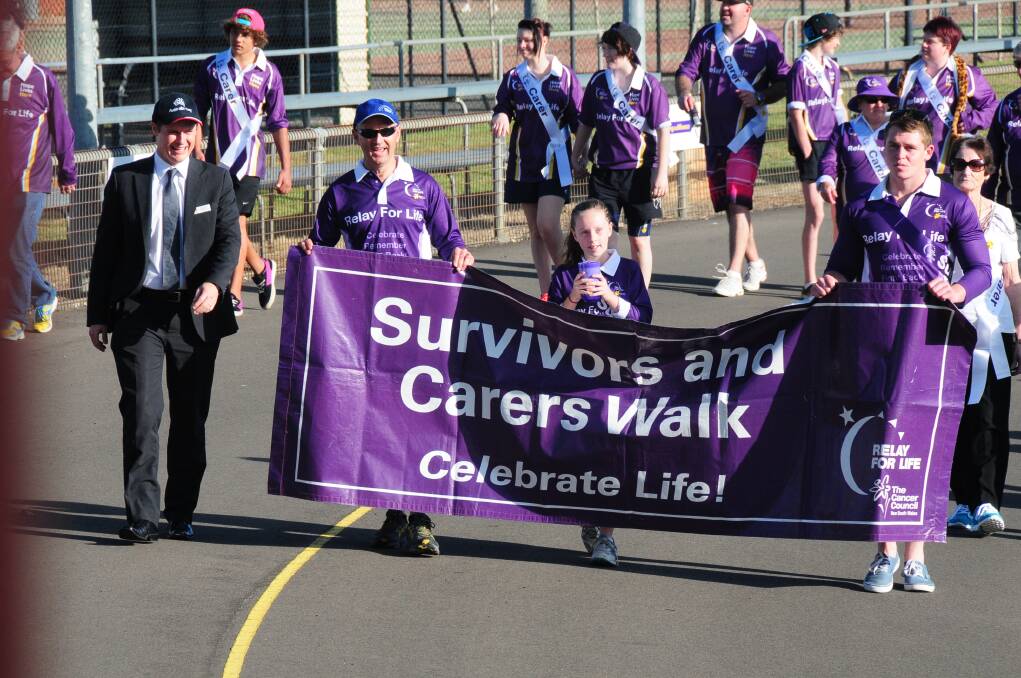 Mathew Dickerson, Rod Smith, Ava Smith and Brent Groves leading the Dubbo and District Relay for Life.	 Photo: HOLLY GRIFFITHS