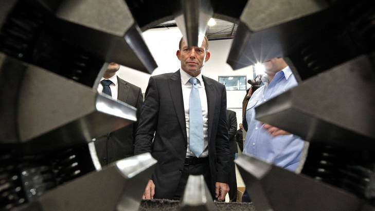 Persisting with his campaign ... the Opposition Leader, Tony Abbott, visits a factory in Rydalmere yesterday.