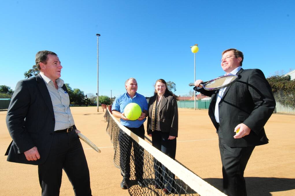 NSW Minister for Sport and Recreation Graham Annesley has a hit at Muller Park Tennis Club with State Member for Dubbo Troy Grant. Watching are club president Ken Bailey and secretary Anne Barwick. Photo: LOUISE DONGES