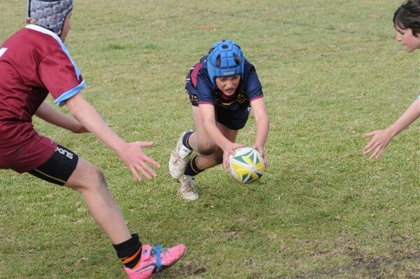 Patty Haycock scores a try for St Mary’s Dubbo in the David Peachey Shield final against Holy Family, Bathurst.