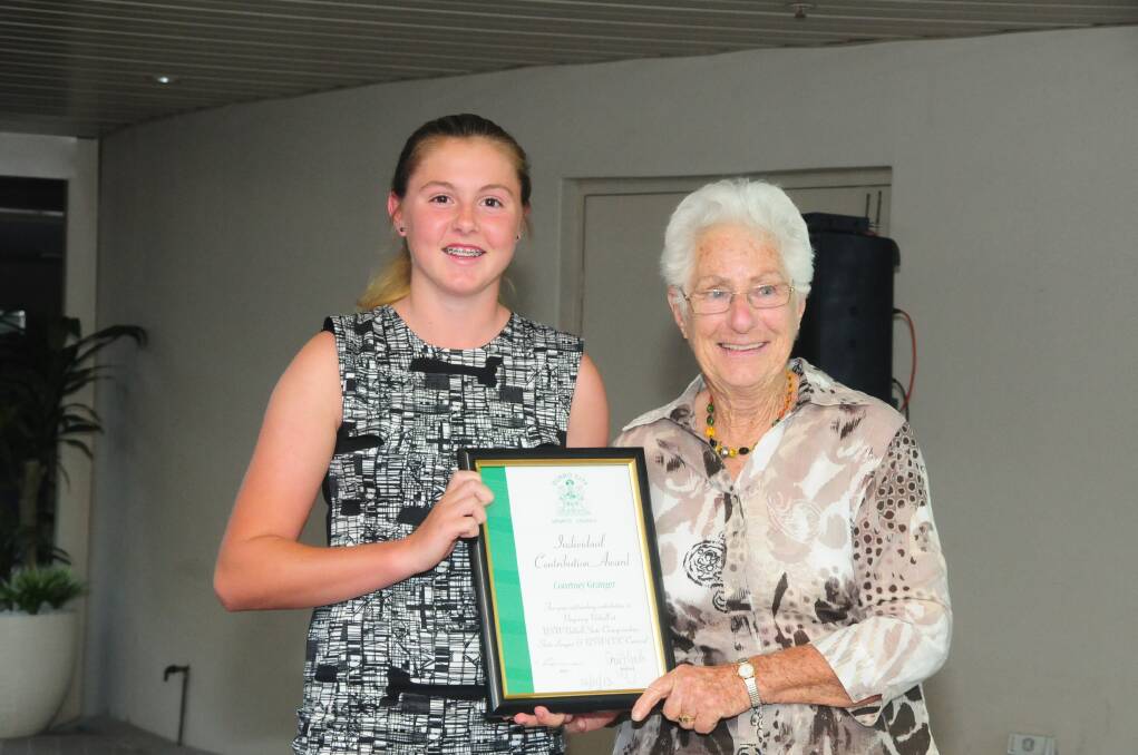 Courtney Granger is presented with her award for Individual Contribution by Nita McGrath.