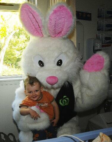 All smiles: Owen Walkom gets up close and personal with the Easter Bunny. 	Photo: Belinda Soole