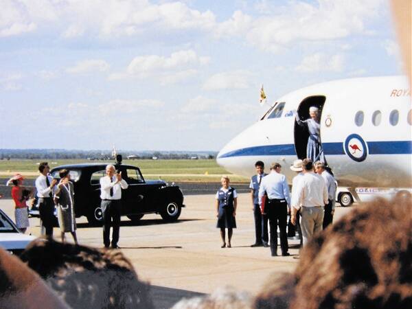 Farewell, Queen Elizabeth II waves goodbye. Photo: Wally Flynn