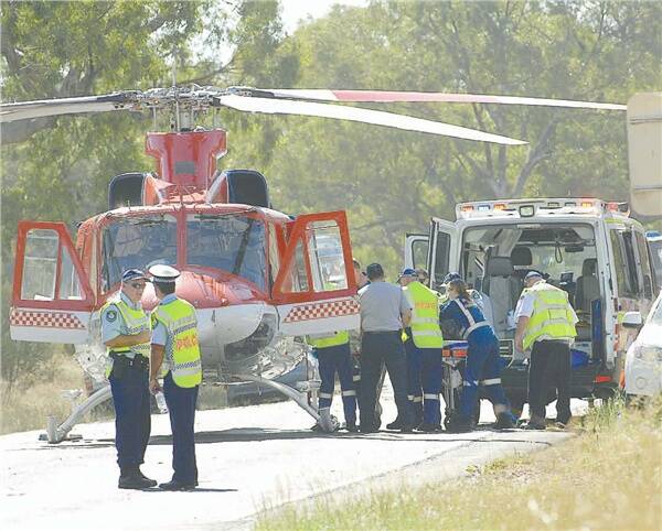 Emergency crews at the scene of the fatal crash where two women were killed and a man was air-lifted to Dubbo Base Hospital in a critical condition.