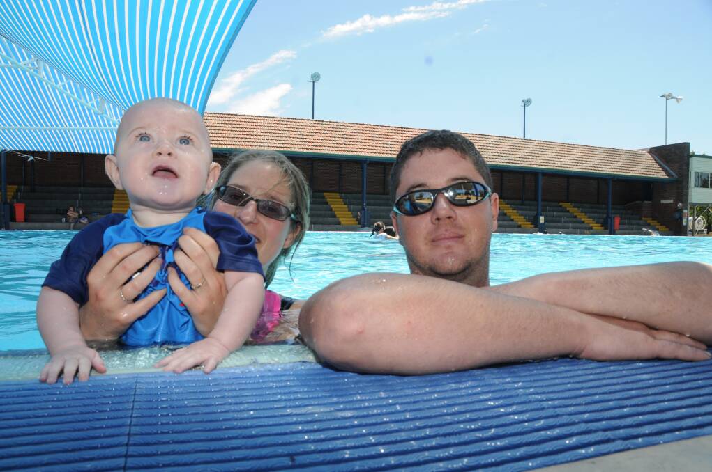 Jason, Alexis and Dave Marshall cool off at Dubbo Aquatic Leisure Centre.  
Photo: JOSH HEARD