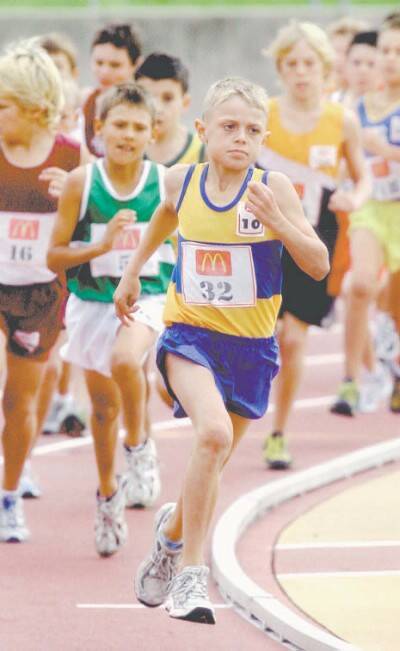 Champion Dubbo athlete Hamish Gordon leads the field in the New South Wales Little As 10 years 1500 metres at Homebush on the weekend. Hamish finished with three gold medals
