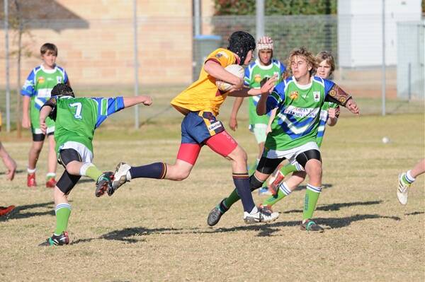 Mitch Dunlop makes a strong run on the way to the try line for St John’s Gold against Eastridge