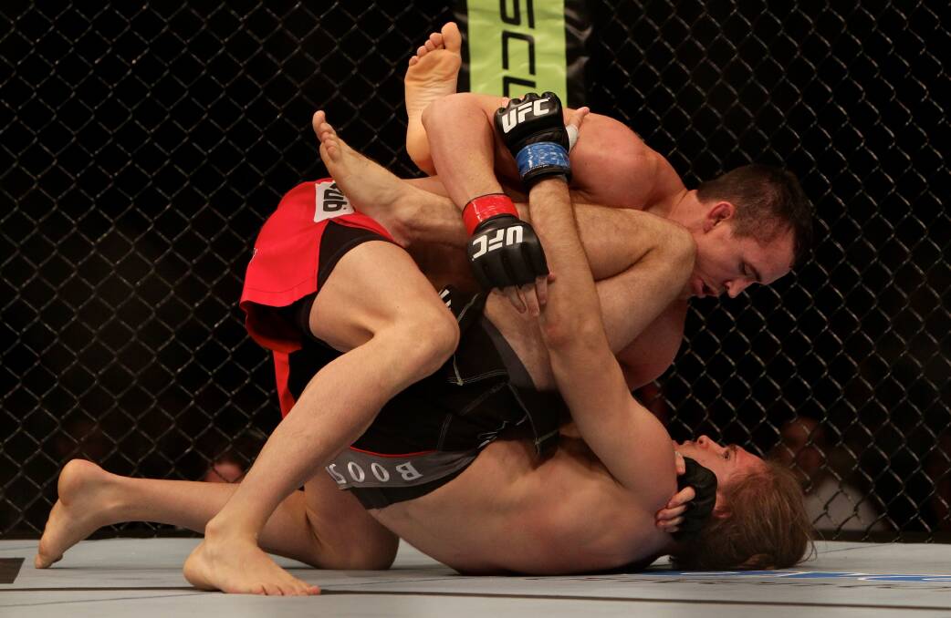 Kyle Noke, seen here during a bout with Andrew Craig in Sydney, will coach the Australian team in the upcoming series of The Ultimate Fighter.