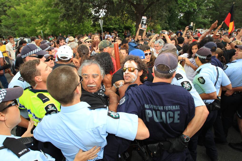 The only remaining founder of the Aboriginal Tent Embassy, Michael Anderson (centre), faces off with police at a protest in Canberra. Mr Anderson will be a special guest at the Western NSW NAIDOC public speaking and debating challenge today. 	  Photo: Alex Ellinghausen