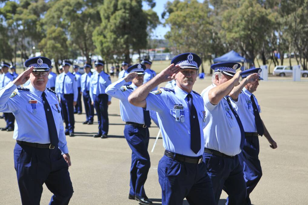 Superintendent Stan Single takes the Commissioner's salute during yesterday's graduation ceremony at the Goulburn Police Academy. 				    		    Photo CONTRIBUTED