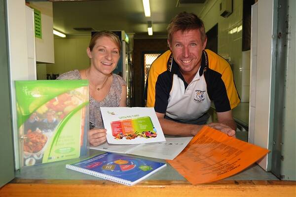 Western NSW Local Health District health promotion officer Emma Fitzgerald and St Mary's Primary School canteen manager Colin Willis.    Photo: Belinda Soole