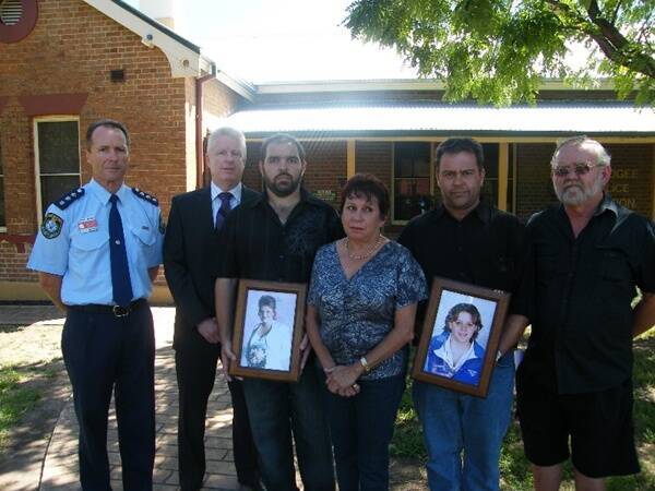 Mudgee Crime Manager Inspector David Payne, Detective Sergeant Cameron Whiteside with members of the Bright family: Michelle’s brother Les, mother Lorraine, brother Phil and father Greg.