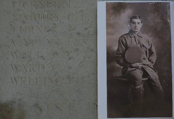 A war memorial wall in France listing Pte John Turner of Dubbo, with a photo of the soldier beside it.