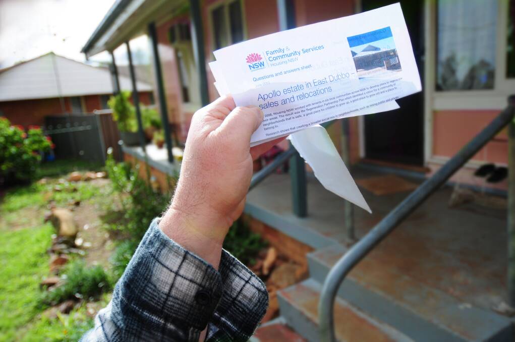 A Housing NSW tenant displays documentation from the department advising that his family's home will be sold as part of a plan to redevelop the Apollo Estate. Photo: LOUISE DONGES.