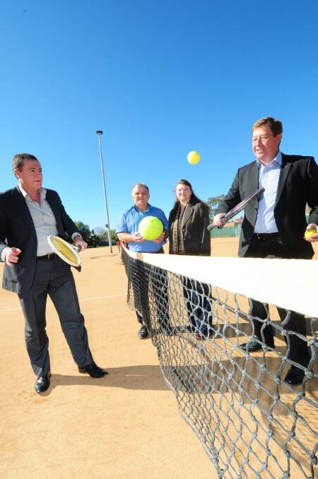 NSW Minister for Sport and Recreation Graham Annesley has a hit at Muller Park Tennis Club with State Member for Dubbo Troy Grant. Watching are club president Ken Bailey and secretary Anne Barwick.  
	Photo: LOUISE DONGES